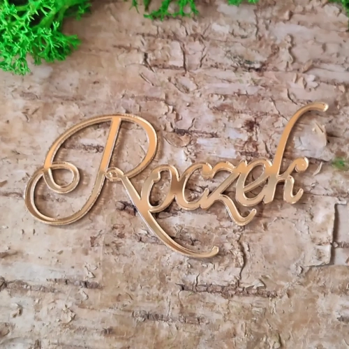 napis-roczek-pleksi-zloto-74x36-tekturkowo.webp